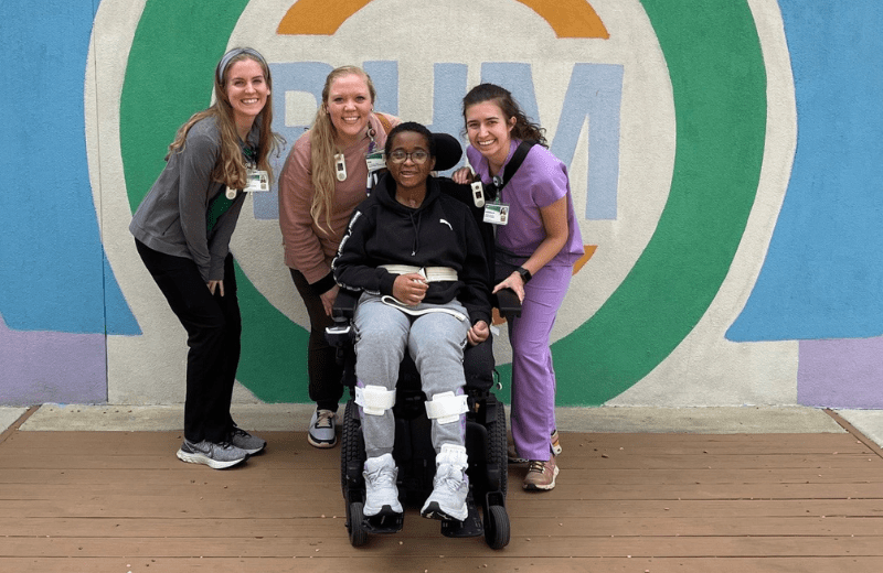 TBI Patient Christy Moore with UAB care team