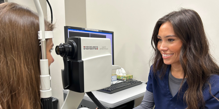 Female medical professional conducting an eye exam