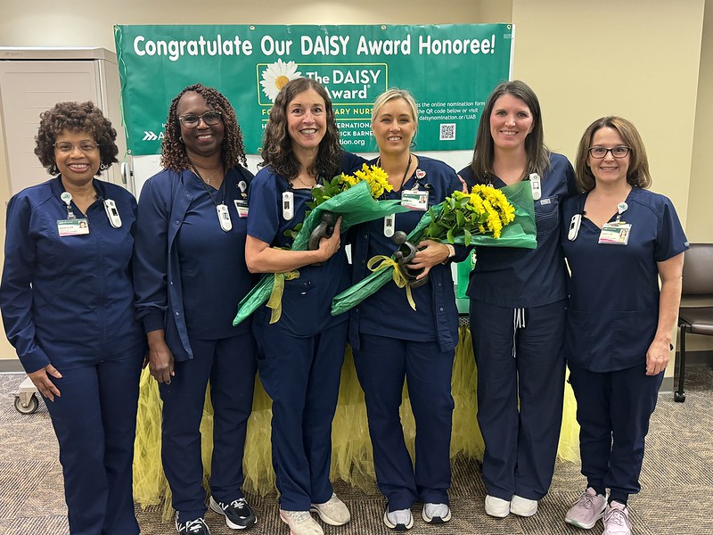 A group of nurses standing and smiling