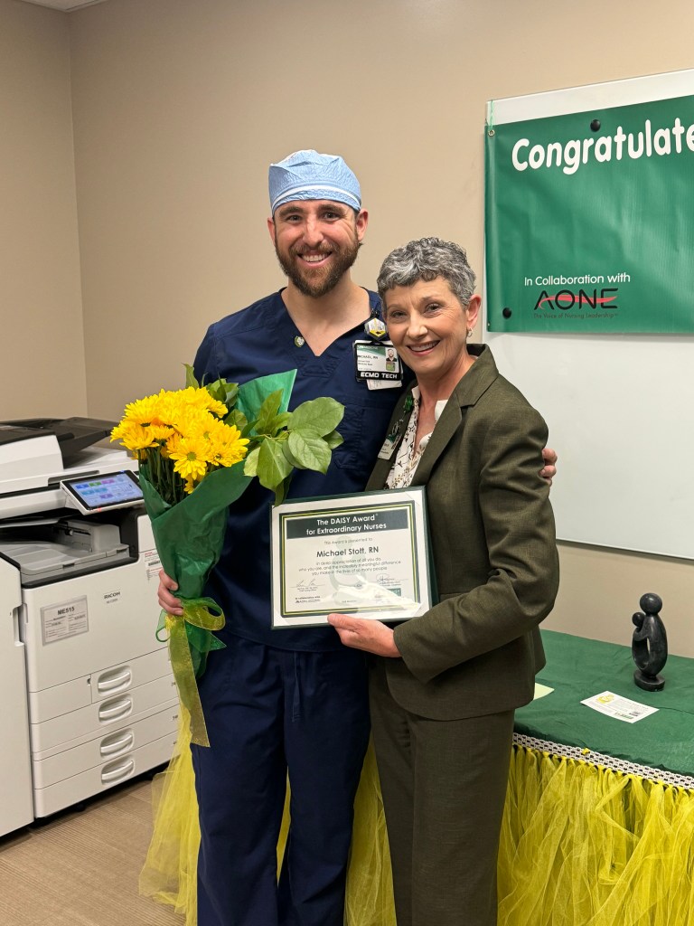 DAISY award winner, nurse Michael Scott, posing with UAB Medicine Chief Nursing Officer, Terri Poe