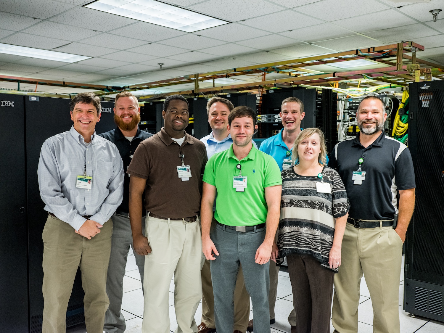 Group of health care information technology employees standing and smiling