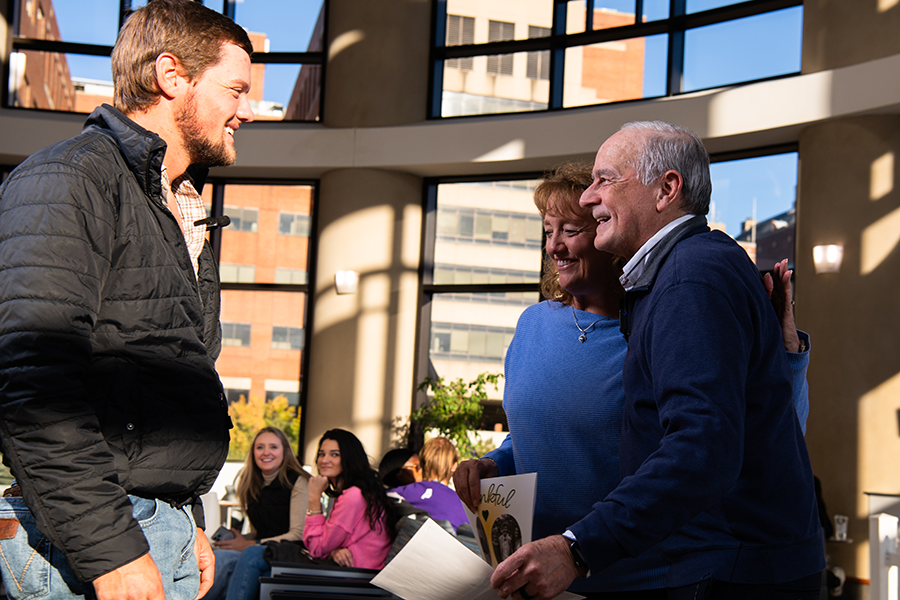 John Emfinger and his mom, Ellen, reunite with Wally Carlo, M.D., neonatologist